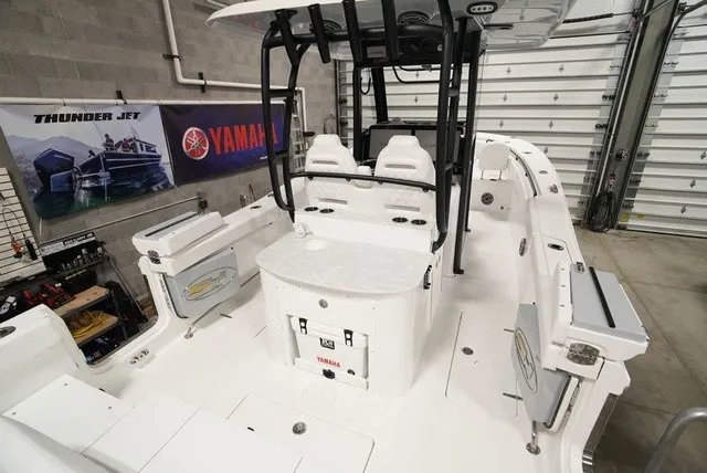 Slide: The Image of The image shows the cockpit of a Sea Hunt Ultra 285SE boat in a garage. - 3