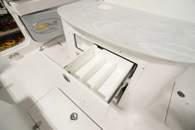 Slide: The Image of A white storage area with drawers on a boat, surrounded by smooth surfaces. - 8