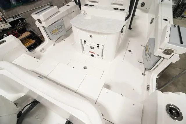 Slide: The Image of The image shows the spacious cockpit of a Sea Hunt Ultra 285SE boat. - 4