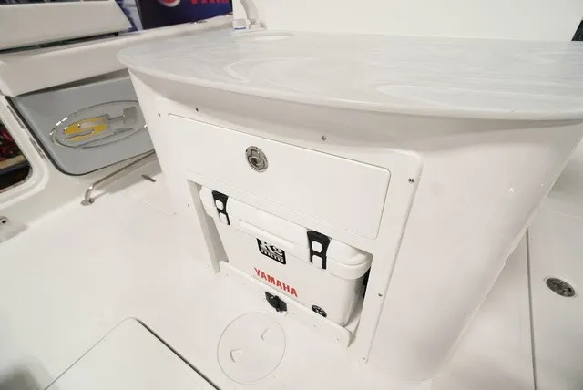 Slide: The Image of The image shows a white boat cooler with Yamaha logo, built into a console. - 7