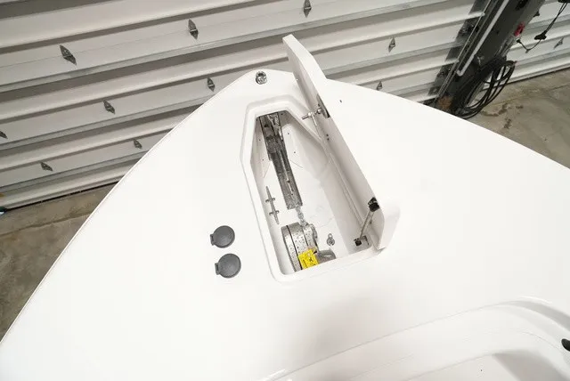 Slide: The Image of The bow of a 2027 Sea Hunt Ultra 285SE with an anchor compartment and cover. - 17