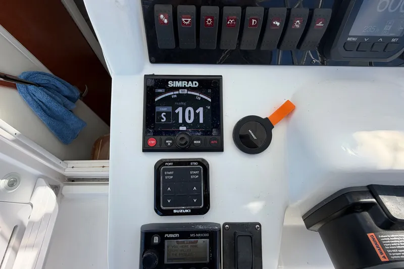 Slide: The Image of Control panel of a 2008 Pro-Line 32 Express boat with Simrad navigation display. - 21