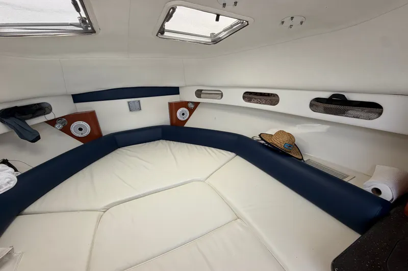 Slide: The Image of Interior cabin of 2008 Pro-Line 32 Express boat with cozy seating and storage. - 30