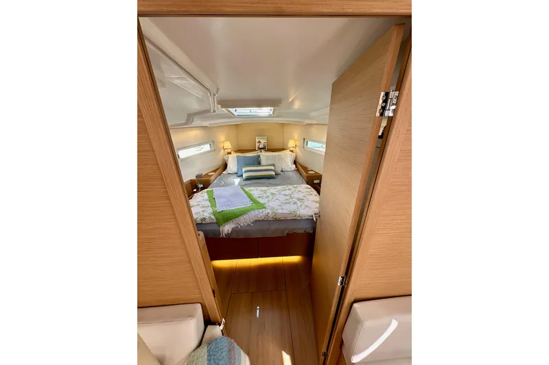 Slide: The Image of Cozy cabin interior of 2024 Jeanneau Sun Odyssey 410 sailboat, featuring a comfortable bed. - 84