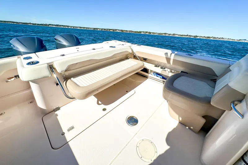 Slide: The Image of 2014 Grady-White Freedom 307 boat interior with seating, ocean view. - 24