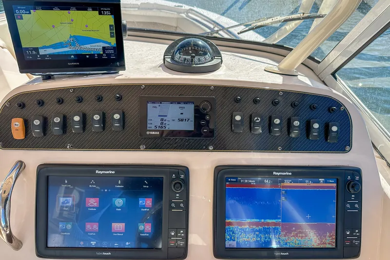 Slide: The Image of Dashboard of 2014 Grady-White Freedom 307 boat with navigation and control systems. - 39
