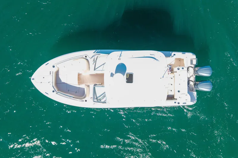 Slide: The Image of Aerial view of 2014 Grady-White Freedom 307 boat on clear blue water. - 55