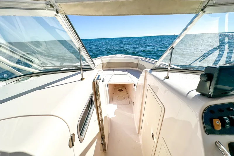 Slide: The Image of 2014 Grady-White Freedom 307 boat interior with ocean view. - 18