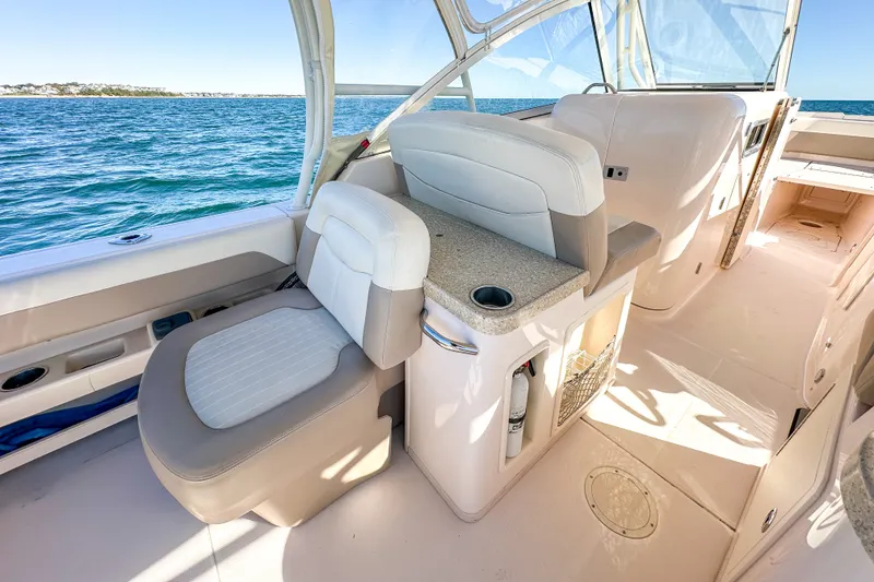 Slide: The Image of 2014 Grady-White Freedom 307 boat interior with seating and ocean view. - 29