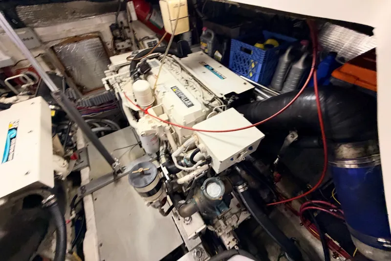 Slide: The Image of Engine room of a 2003 Luhrs 36 Open boat, showcasing mechanical components and equipment. - 25