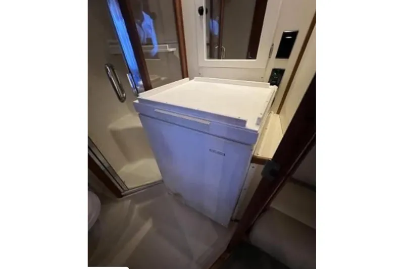 Slide: The Image of Compact freezer in 2003 Luhrs 36 Open yacht interior. - 15