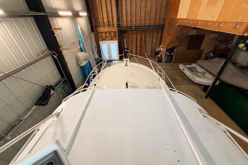 Slide: The Image of 2003 Luhrs 36 Open boat stored indoors, viewed from above. - 34