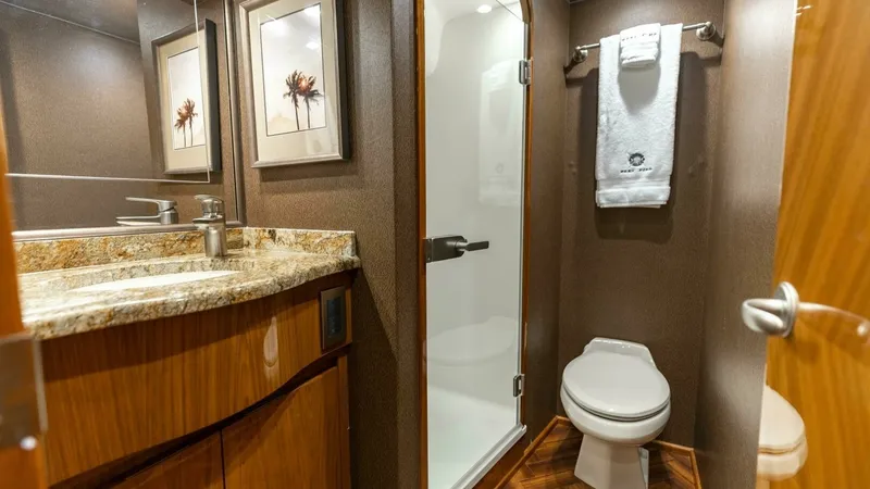 Slide: The Image of 2013 Viking 76 Convertible- REEL FIRE- Starboard Stateroom Head - 48