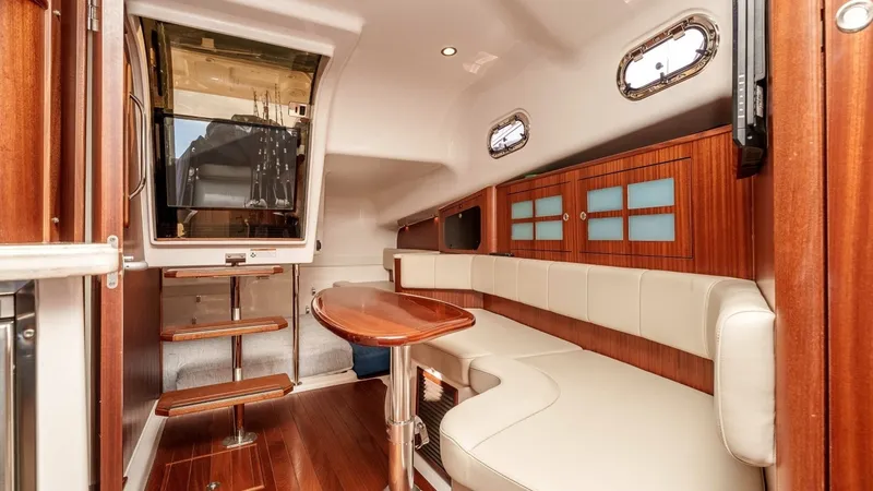 Slide: The Image of 2018 Pursuit 385 Offshore "TAG TEAM" - Spacious Cabin Lounge with Dinette - 6