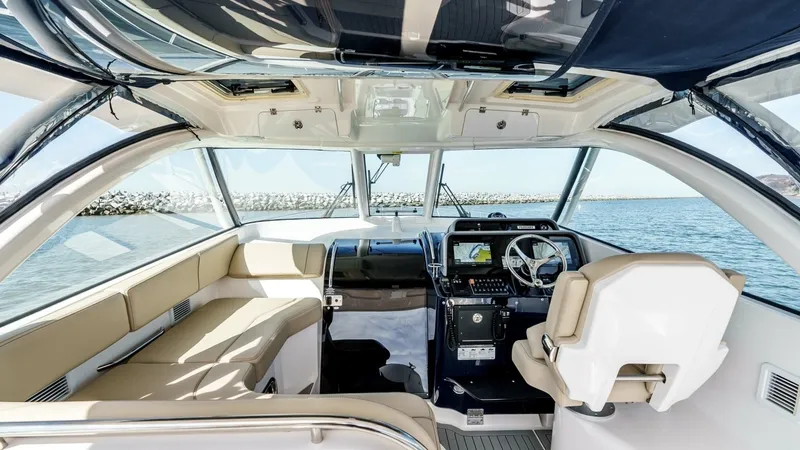 Slide: The Image of 2018 Pursuit 385 Offshore "TAG TEAM" - Spacious Helm and Seating Area - 2