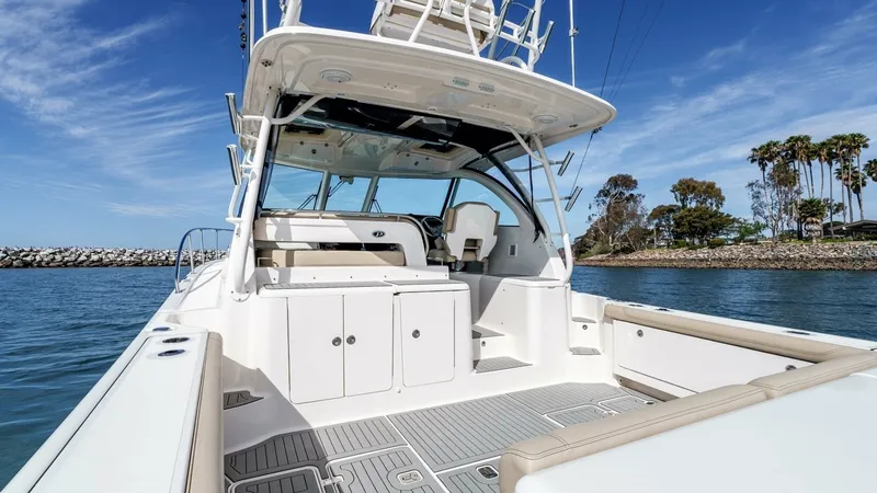 Slide: The Image of 2018 Pursuit 385 Offshore "TAG TEAM" - Spacious Aft Deck with Helm View - 18