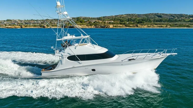 The Image of 2007 Hatteras 64 Convertible CHUPACABRA - Starboard Profile Underway in Open Water - 1