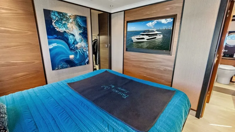 Slide: The Image of Master Stateroom with Art and TV - 22
