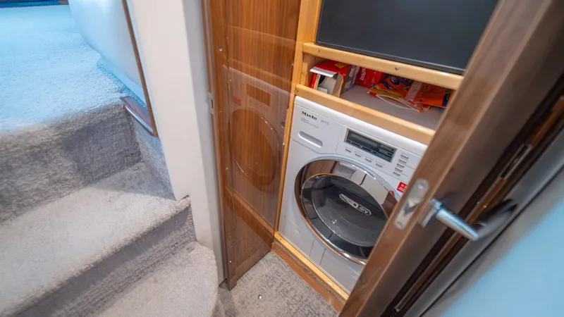 Slide: The Image of Compact Laundry Area with Washer - 79