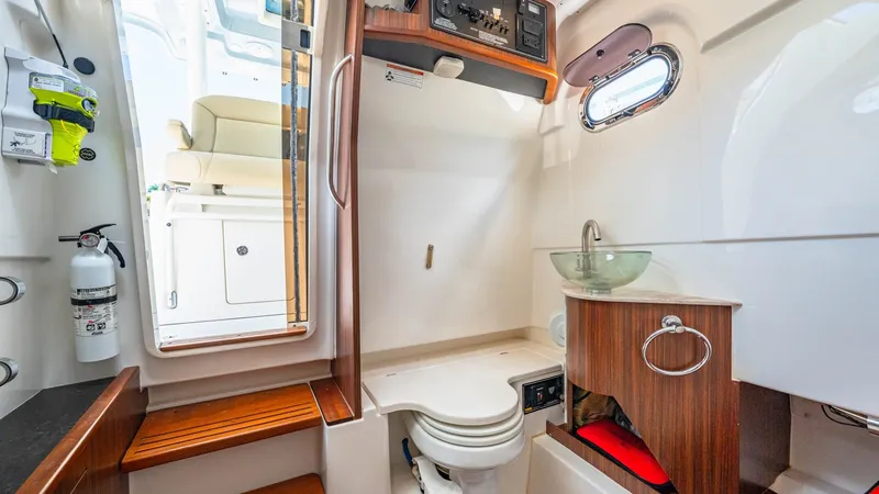 Slide: The Image of Luxurious Onboard Head with Teak Accents - 40