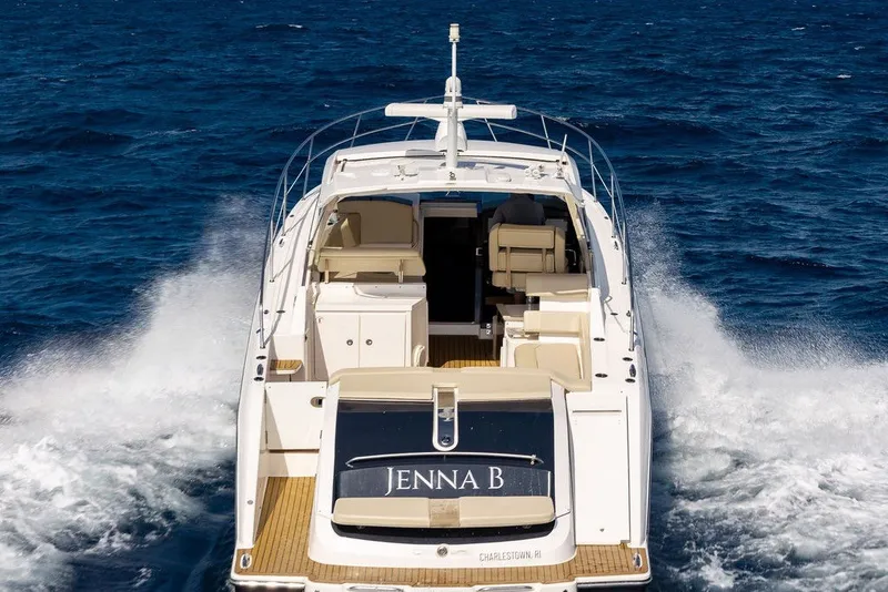 Slide: The Image of 2017 Pursuit SC 365i Sport Coupe cruising on open water, rear view. - 11