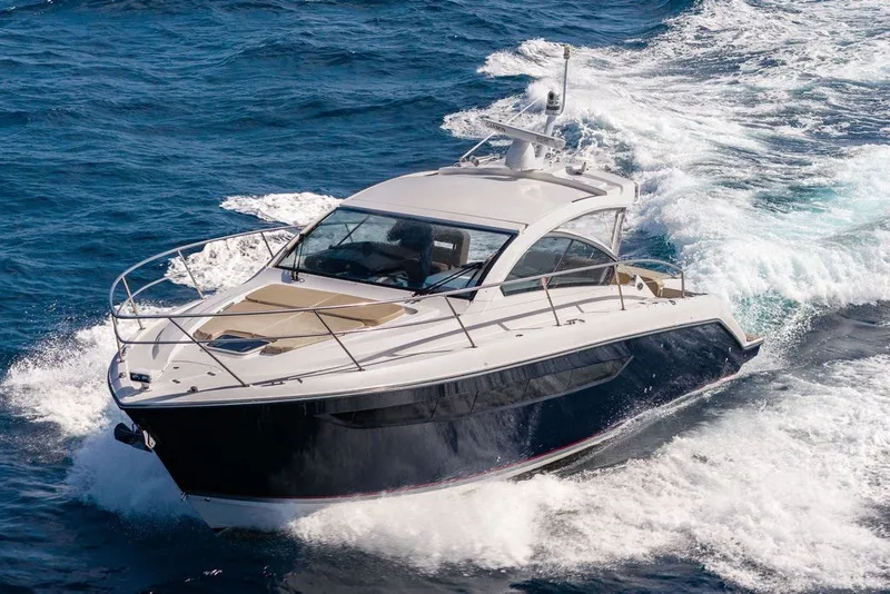 Slide: The Image of 2017 Pursuit SC 365i Sport Coupe cruising on open water, showcasing sleek design and performance. - 10