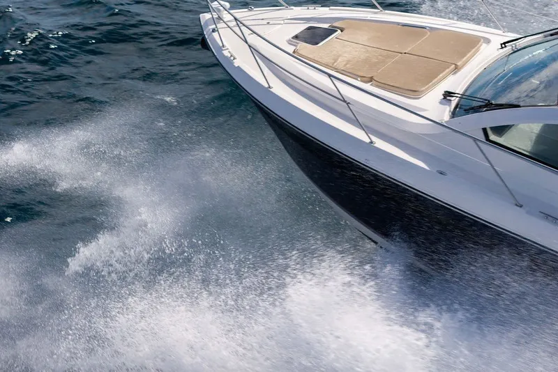 Slide: The Image of 2017 Pursuit SC 365i Sport Coupe cruising on open water, showcasing sleek design and performance. - 7