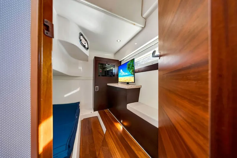 Slide: The Image of Luxurious interior of 2017 Pursuit SC 365i Sport Coupe with wood accents and modern amenities. - 27