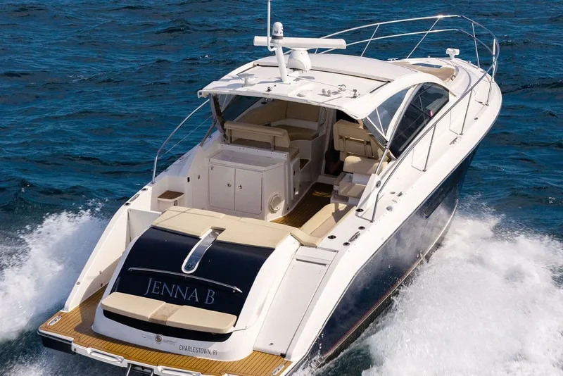 Slide: The Image of 2017 Pursuit SC 365i Sport Coupe cruising on open water, rear view. - 4