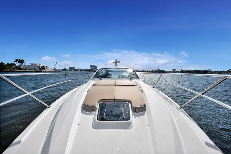 Slide: The Image of 2017 Pursuit SC 365i Sport Coupe cruising on a sunny day, showcasing sleek design and luxury. - 13