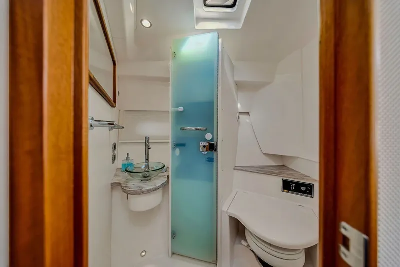 Slide: The Image of Luxurious bathroom in 2017 Pursuit SC 365i Sport Coupe yacht with modern fixtures. - 33