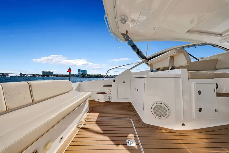Slide: The Image of 2017 Pursuit SC 365i Sport Coupe interior with sleek design and waterfront view. - 15