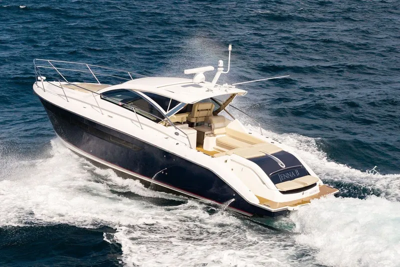 Slide: The Image of 2017 Pursuit SC 365i Sport Coupe cruising on open water, showcasing sleek design and luxury. - 2