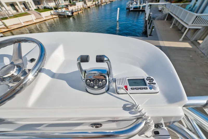 Slide: The Image of Helm of 2005 Cabo 35 Express boat with steering wheel and control panel. - 16