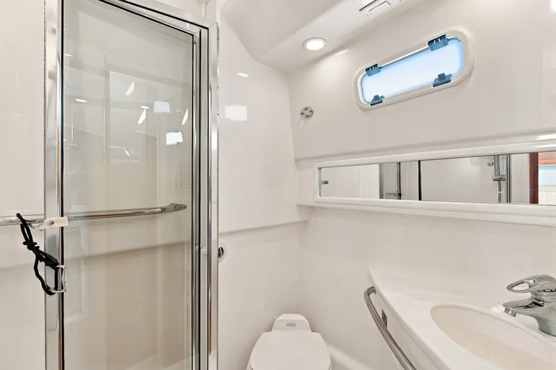 Slide: The Image of Bathroom interior of 2005 Cabo 35 Express yacht with shower and sink. - 26