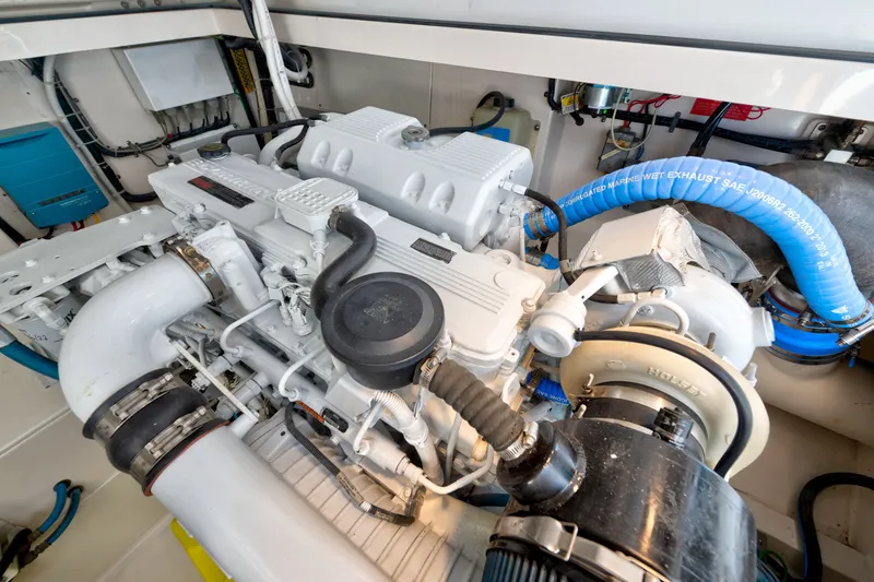Slide: The Image of Engine room of a 2005 Cabo 35 Express boat, showcasing detailed machinery and components. - 33