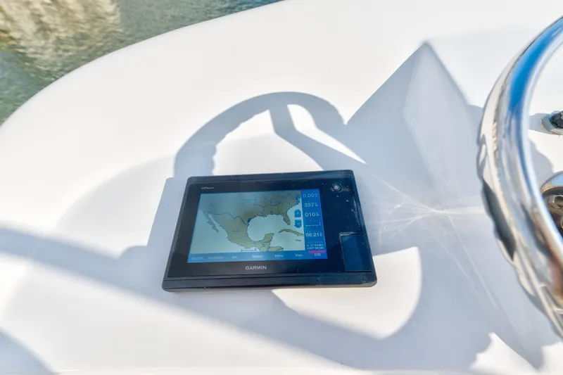Slide: The Image of Garmin GPS on 2005 Cabo 35 Express boat dashboard, displaying navigation map. - 15