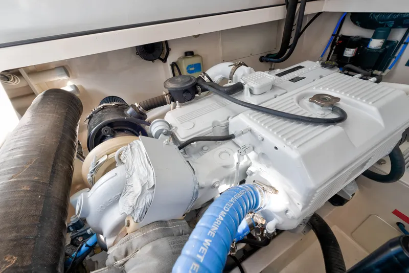 Slide: The Image of Engine compartment of a 2005 Cabo 35 Express boat, showcasing detailed machinery. - 31