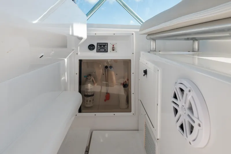 Slide: The Image of 2005 Cabo 35 Express interior with seating, control panel, and speaker. - 7