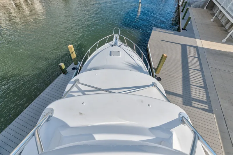 Slide: The Image of 2005 Cabo 35 Express yacht docked at marina, viewed from above. - 19