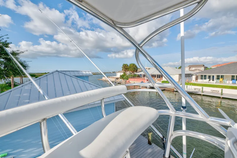 Slide: The Image of 2005 Cabo 35 Express boat view from deck overlooking marina and waterfront homes. - 17