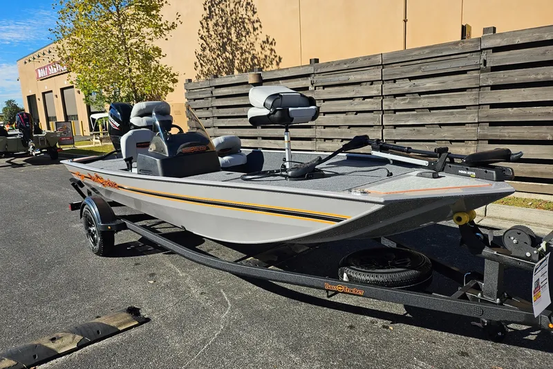 The Image of 2027 Tracker Bass Tracker Classic Limited boat on trailer, parked outdoors. - 0