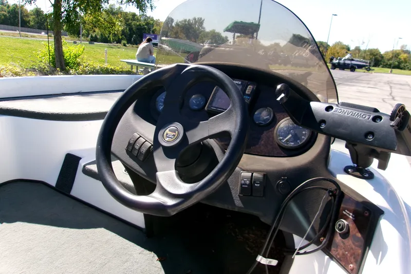 Slide: The Image of Steering console of a 2002 Triton Tr-175 SC boat with gauges and controls. - 1