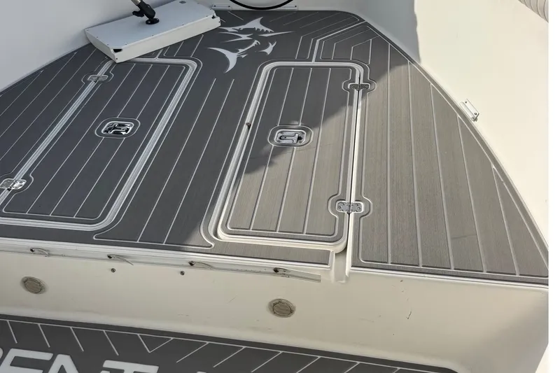 Slide: The Image of Deck of a 2001 Century 2900 Center Console boat with sleek gray flooring. - 15
