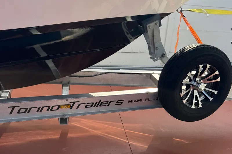 Slide: The Image of Trailer with Century 2900 Center Console boat, 2001 model, on Torino Trailers in Miami. - 21