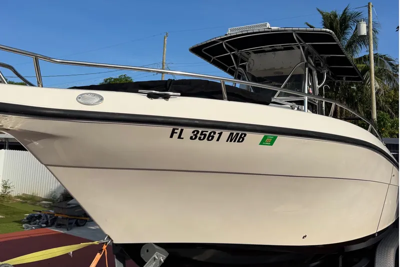 Slide: The Image of 2001 Century 2900 Center Console boat with Florida registration, docked outdoors. - 17