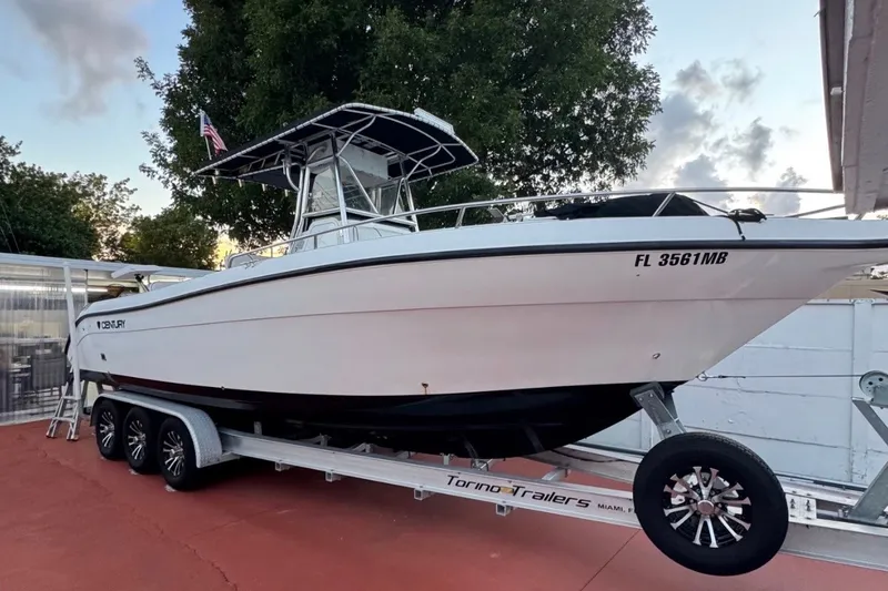 The Image of 2001 Century 2900 Center Console boat on trailer, parked outdoors. - 0