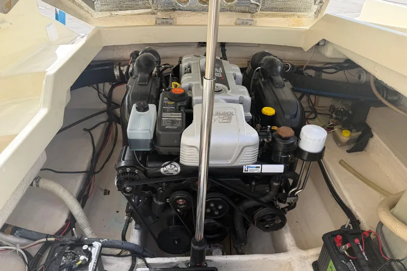 Slide: The Image of Engine compartment of a 2001 Chris-Craft Launch 28 boat, showcasing the V8 engine. - 27