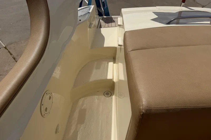 Slide: The Image of 2001 Chris-Craft Launch 28 boat interior with beige seating and white deck. - 26