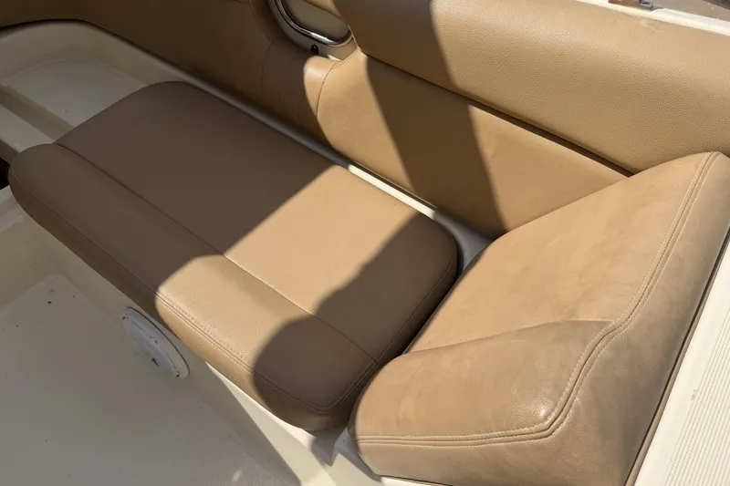 Slide: The Image of Tan leather seating on a 2001 Chris-Craft Launch 28 boat. - 25